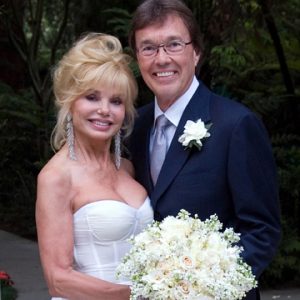 Elisa with her husband Bob flick on her wedding day.