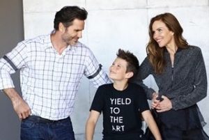 Sarah took a picture with her husband and son