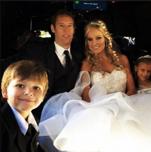 Mike Whickham is Wife Heidi Watney during their wedding.