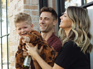 Andrew Walker with his wife Cassandra and holding his son West.