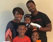 Eboni with her husband and three children, a son and two daughters. Image