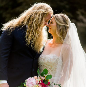 Alan and Kaitlyn took a picture during their wedding