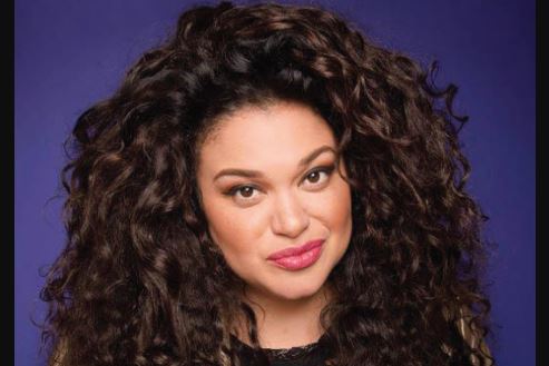 Michelle Buteau, an American stand-up comedian, actress & podcast host
